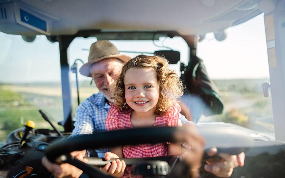 grandpa-and-granddaughter-in-tractor
